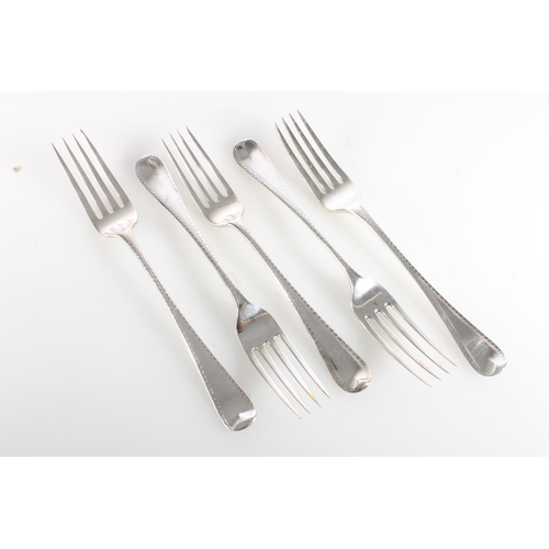 68 - Harlequin set of five silver table forks with bright cut borders, various makers, 318g.