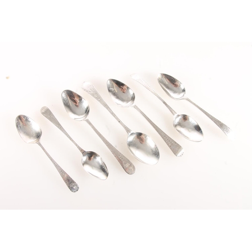 75 - Seven non-matching silver teaspoons with bright cut borders, various makers, 75g gross.