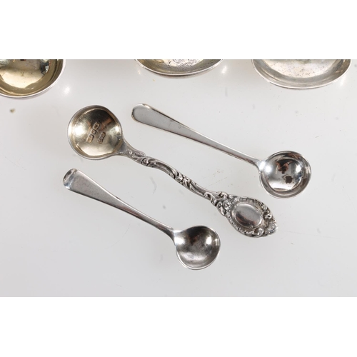 99 - Group of silver mustard, caddy and salt spoons, 81g gross.