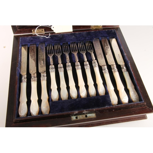 106 - Set of twelve Victorian silver and mother-of-pearl handled fruit knives and forks by Martin, Hall &a... 