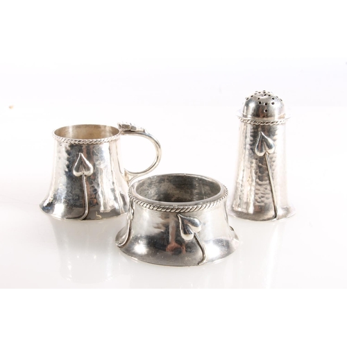 129 - Edwardian Art Nouveau silver three piece cruet set with planish bodies decorated with organic floral... 