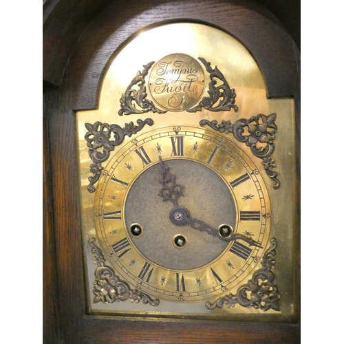 516 - 1930s oak cased grandmother clock with brass ''Tempus Fugit'' dial, the case boasting stylised flora... 