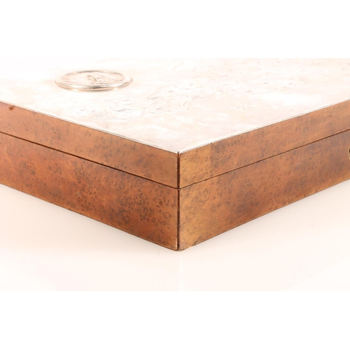 143 - Continental silver and birds eye walnut table cigarette or cigar box, the hinge top with sheet of si... 