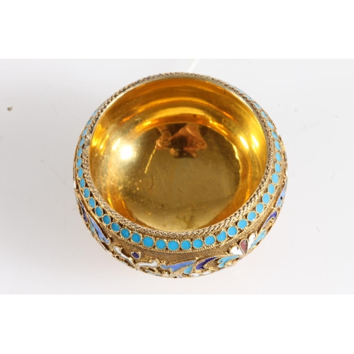 144 - Russian 84zl grade silver gilt and enamel salt cellar of hemi spherical form raised on three ball fe... 