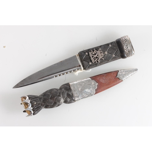 156 - White metal mounted sgian dubh of typical form, stamped R&HBK for Kirkwood of Edinburgh, and another... 