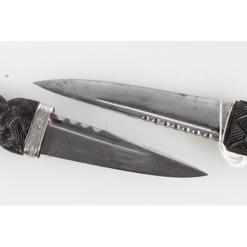 156 - White metal mounted sgian dubh of typical form, stamped R&HBK for Kirkwood of Edinburgh, and another... 