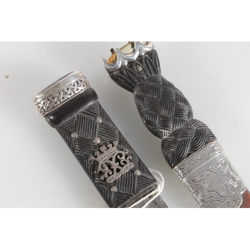 156 - White metal mounted sgian dubh of typical form, stamped R&HBK for Kirkwood of Edinburgh, and another... 