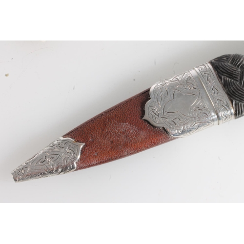 156 - White metal mounted sgian dubh of typical form, stamped R&HBK for Kirkwood of Edinburgh, and another... 