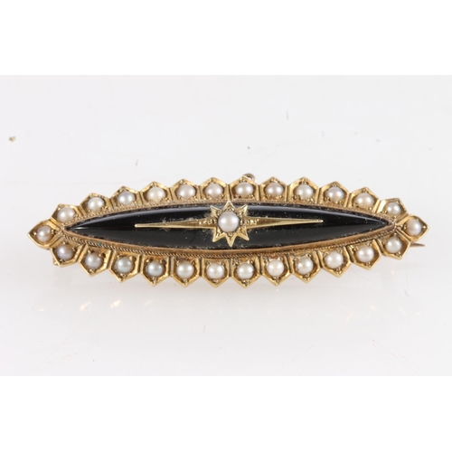 181 - Victorian unmarked yellow metal mourning brooch of navette shape set with black onyx and seed pearls... 