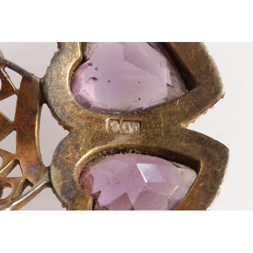 182 - 9ct gold amethyst and seed pearl brooch in the form of crowned double love hearts, stamped 9ct, 6.1g... 