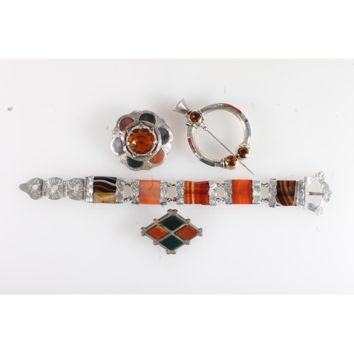 191 - Scottish pebble set white metal bracelet of buckle and strap form set with banded agate, probably si... 