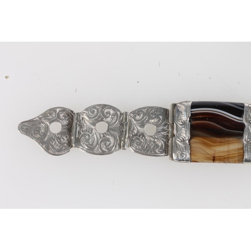 191 - Scottish pebble set white metal bracelet of buckle and strap form set with banded agate, probably si... 