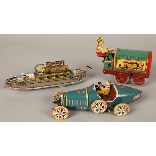 36 - Five vintage tin toys including steam train, ship, racing car, boxed rabbit and a boxed duck(5)