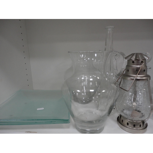 105 - Shelf lot of glass to include crystal decanters with stoppers, glass jugs and vases.