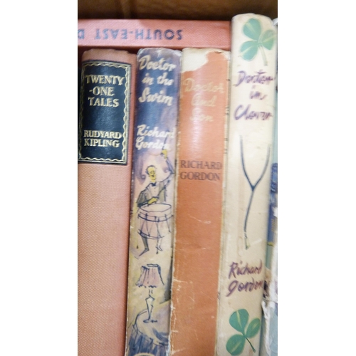 11 - Two cartons of books to include novels, Britain, Giles, humorous etc.