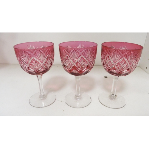 110B - Cranberry glass jug and sugar sifter, with three tinted crystal cranberry glasses. (5)