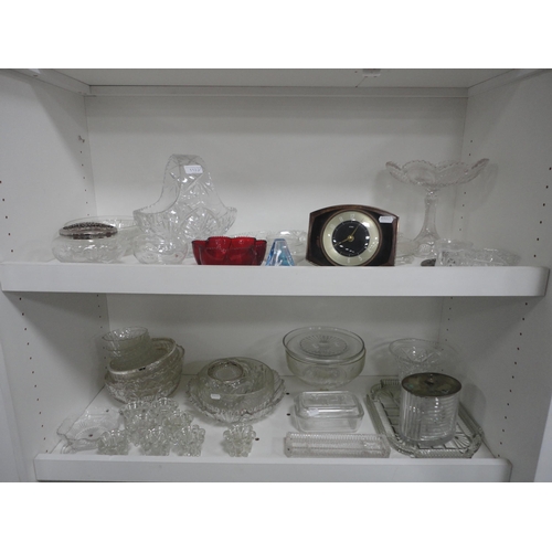 112 - Two shelves of assorted glass to include bowls, basket etc with Metamec mantel clock.