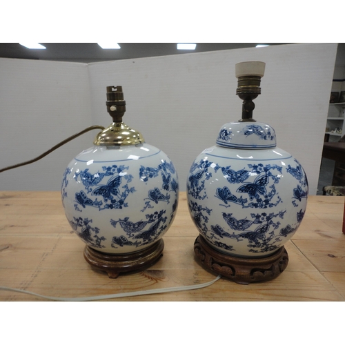 129 - Pair of Creamware ceramic table lamps with two of Chinese style blue and white ceramic table lamps, ... 