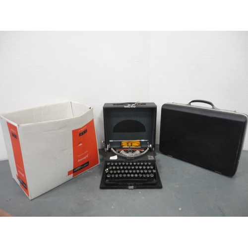 137 - Boxed Imperial typewriter with attaché briefcase and box of wall brackets.