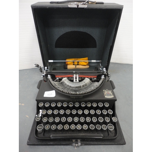 137 - Boxed Imperial typewriter with attaché briefcase and box of wall brackets.