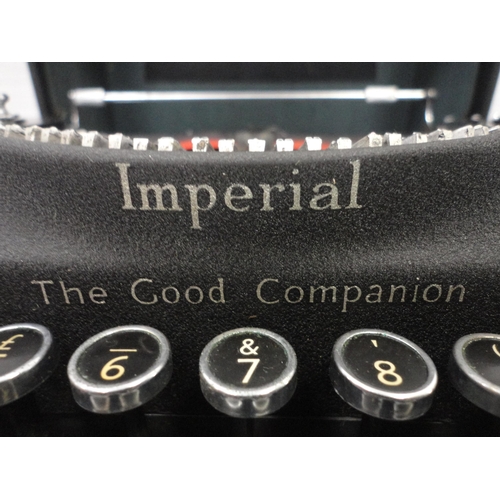 137 - Boxed Imperial typewriter with attaché briefcase and box of wall brackets.