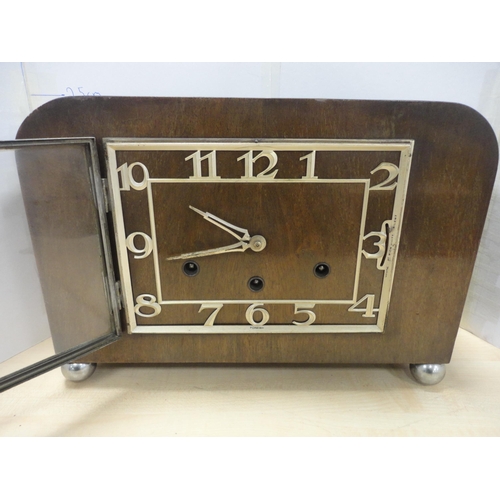 139 - Mantel clock with cased Canon camera and two others. (4)