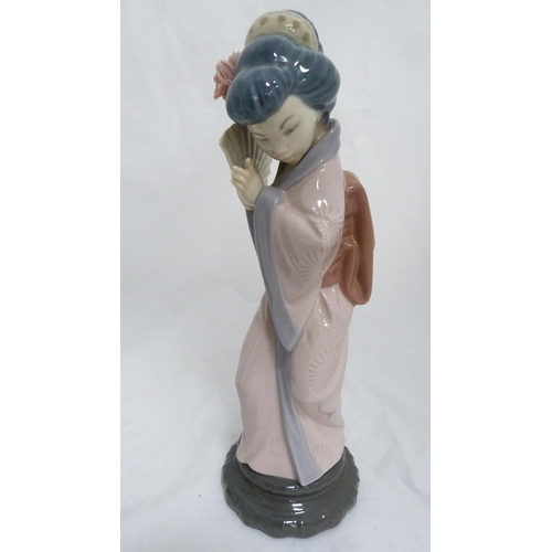 152 - Two Lladro figures modelled as Japanese Geisha girls, with Goebel bird figure. (3)