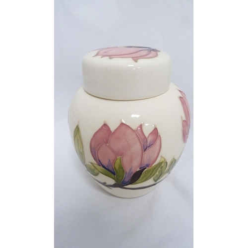 153 - Moorcroft tube lined cream glazed jar with cover.