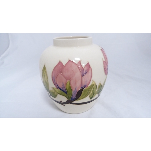 153 - Moorcroft tube lined cream glazed jar with cover.