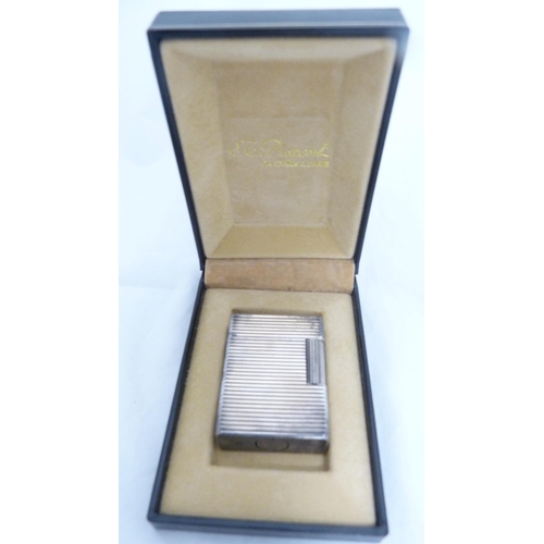 157 - Boxed Dupont lighter with Zippo lighter and another lighter, and white metal snuffer in the form of ... 