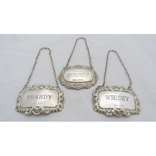 168 - Three silver spirit labels for whisky, brandy and sherry, with hanging chains.