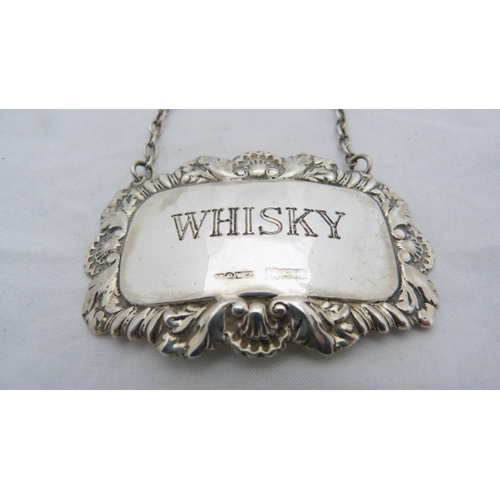 168 - Three silver spirit labels for whisky, brandy and sherry, with hanging chains.