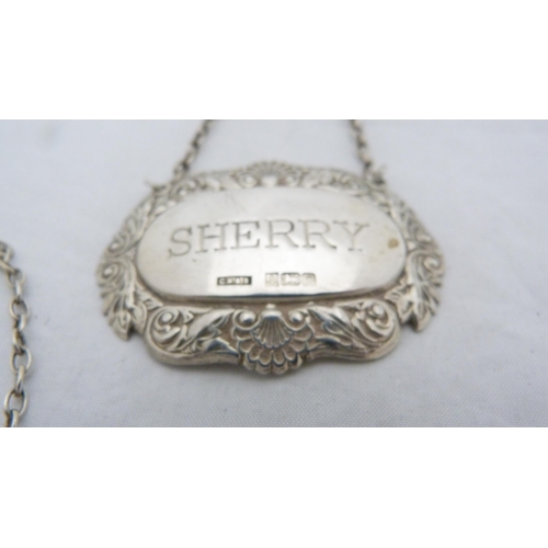 168 - Three silver spirit labels for whisky, brandy and sherry, with hanging chains.