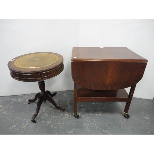 207 - Tea trolley and drum-shaped occasional table with tooled top. (2)