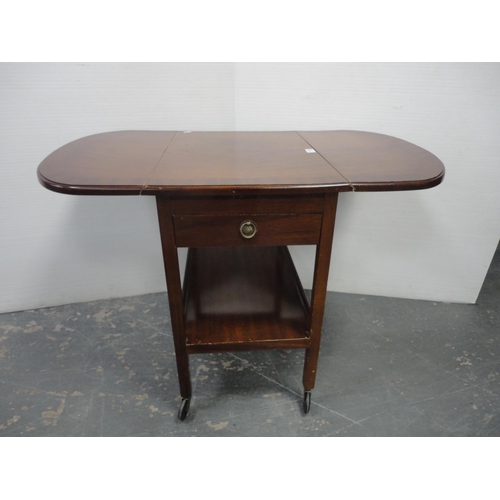 207 - Tea trolley and drum-shaped occasional table with tooled top. (2)