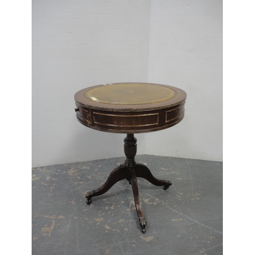 207 - Tea trolley and drum-shaped occasional table with tooled top. (2)