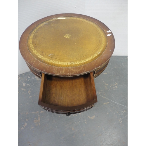 207 - Tea trolley and drum-shaped occasional table with tooled top. (2)