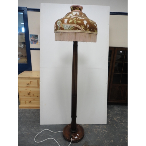 211 - Mahogany fluted floor lamp with shade.