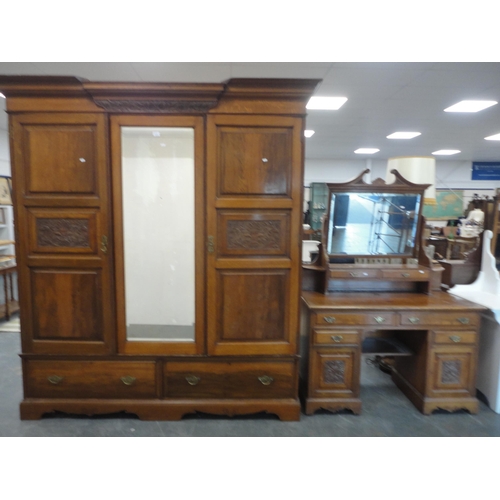 213 - Late Victorian carved two-piece bedroom suite comprising mirror-door wardrobe and kneehole dressing ... 