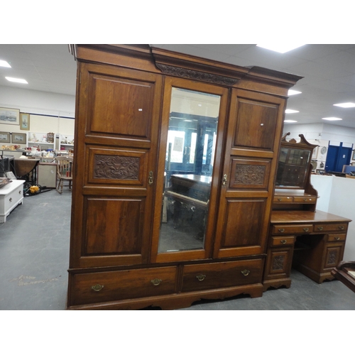 213 - Late Victorian carved two-piece bedroom suite comprising mirror-door wardrobe and kneehole dressing ... 