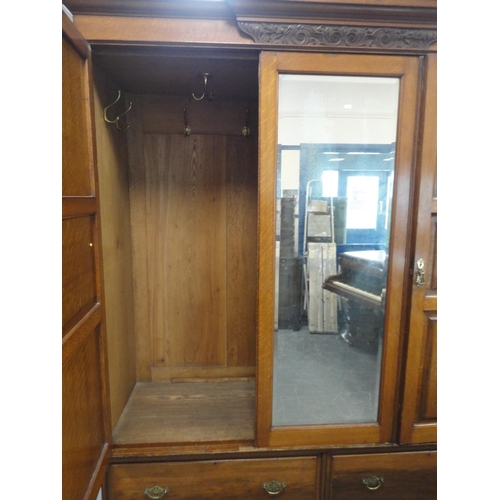 213 - Late Victorian carved two-piece bedroom suite comprising mirror-door wardrobe and kneehole dressing ... 