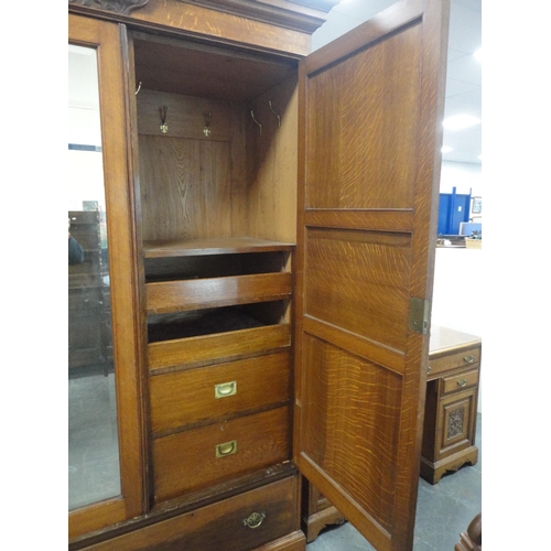 213 - Late Victorian carved two-piece bedroom suite comprising mirror-door wardrobe and kneehole dressing ... 