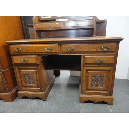 213 - Late Victorian carved two-piece bedroom suite comprising mirror-door wardrobe and kneehole dressing ... 