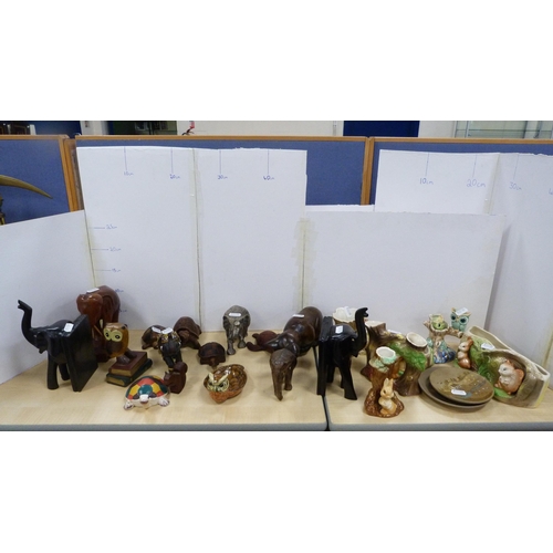 22 - Elephant and tortoise figures, bookends, Hornsea spill vases decorated with rabbits and others.