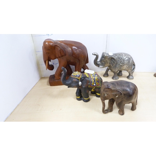 22 - Elephant and tortoise figures, bookends, Hornsea spill vases decorated with rabbits and others.