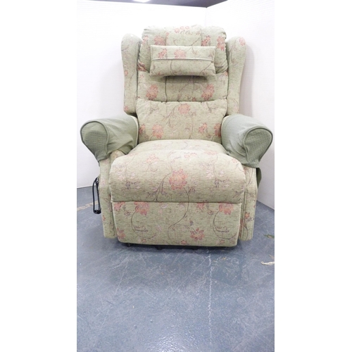 229 - Floral upholstered electric reclining armchair.