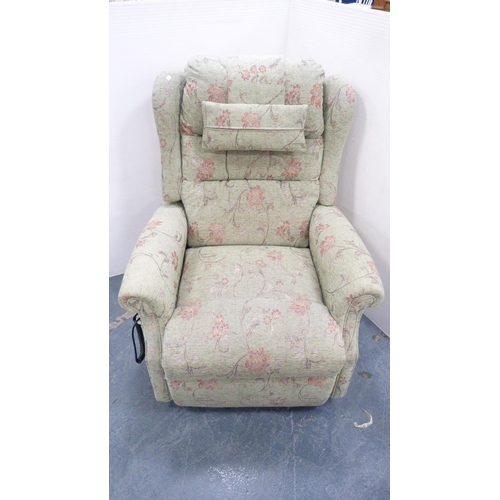 229 - Floral upholstered electric reclining armchair.