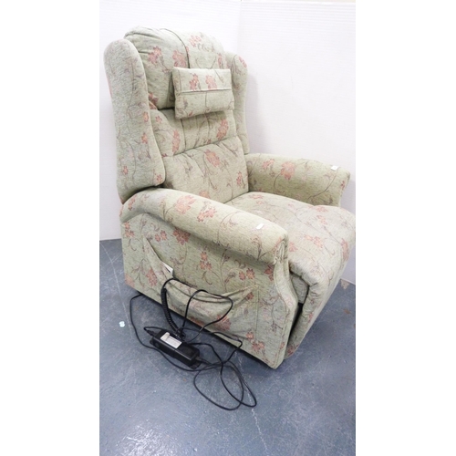 229 - Floral upholstered electric reclining armchair.