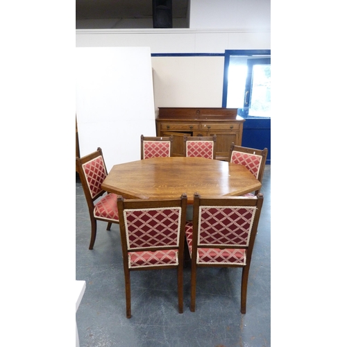 233 - Oak composite eight piece oak dining room suite, Comprising of sideboard, octagonal centre table and... 