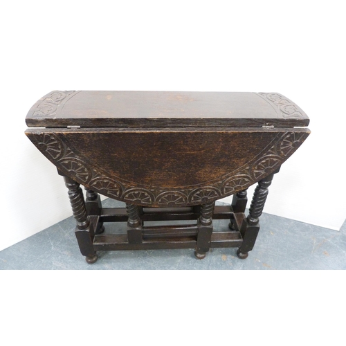 239 - Small carved oak supper table. 